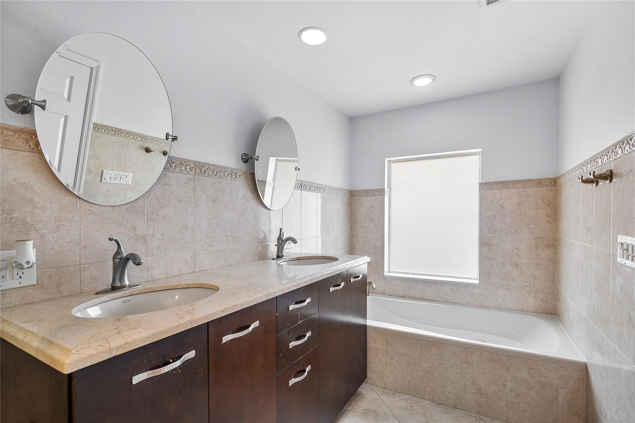 290 Northeast 29th Street Boca Raton, FL 33431 - Photo 24 of 48 a bathroom with a double vanity sink and a mirror