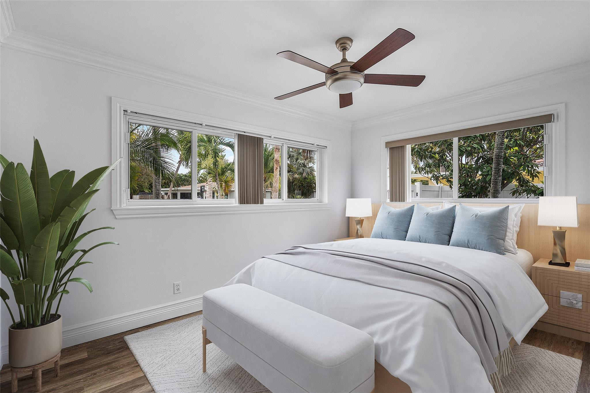 290 Northeast 29th Street Boca Raton, FL 33431 - Photo 25 of 48 a bedroom with a large bed window and potted plant