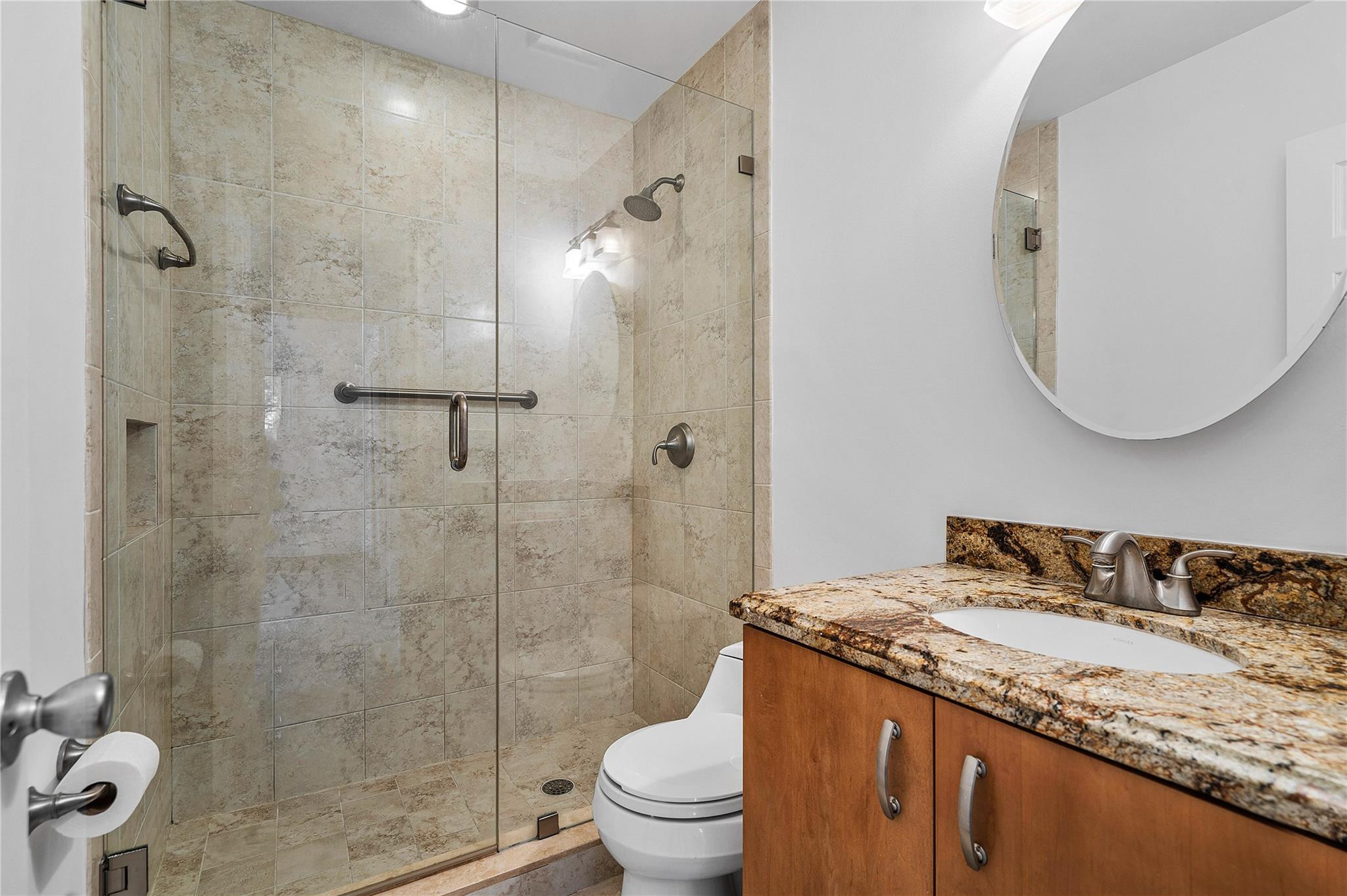 290 Northeast 29th Street Boca Raton, FL 33431 - Photo 26 of 48 a bathroom with a granite countertop sink toilet and shower