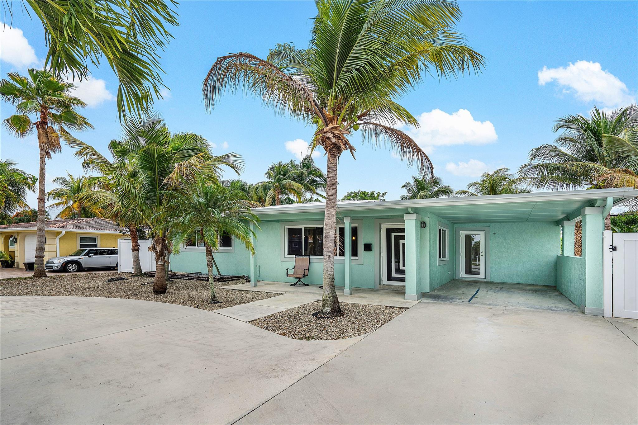 290 Northeast 29th Street Boca Raton, FL 33431 - Photo 48 of 48 a view of a house with a yard and palm trees