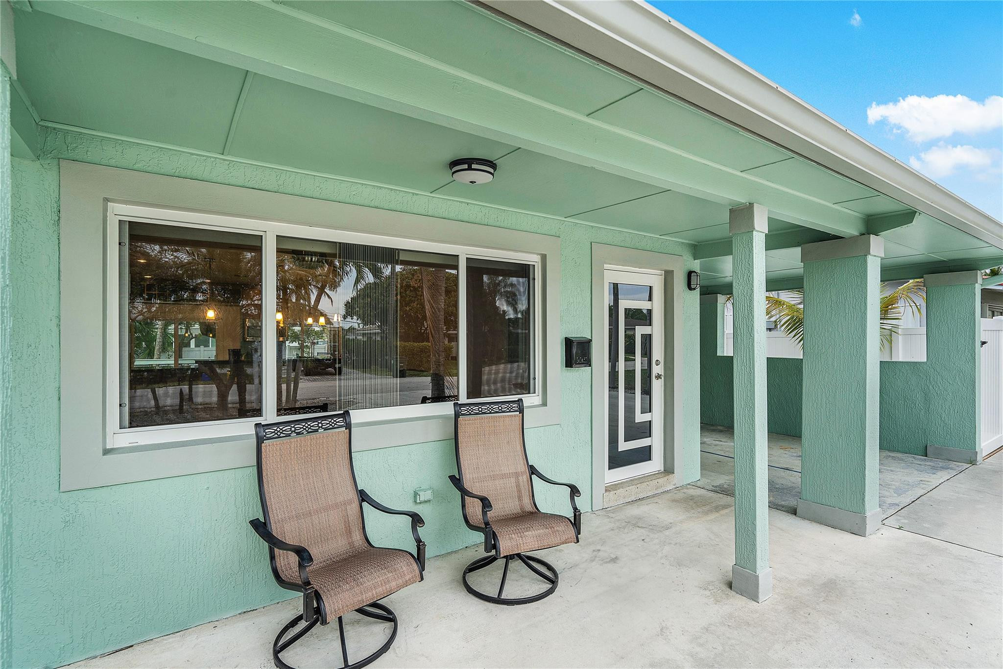 290 Northeast 29th Street Boca Raton, FL 33431 - Photo 6 of 48 a view of a house with sitting area and porch
