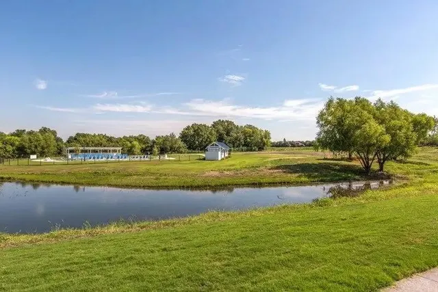 a view of a lake with a big yard