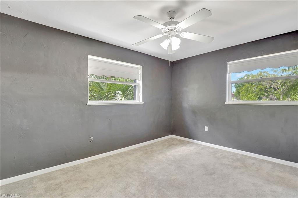 4656 Capri Drive Naples, FL 34103 - Photo 11 of 18 an empty room with windows