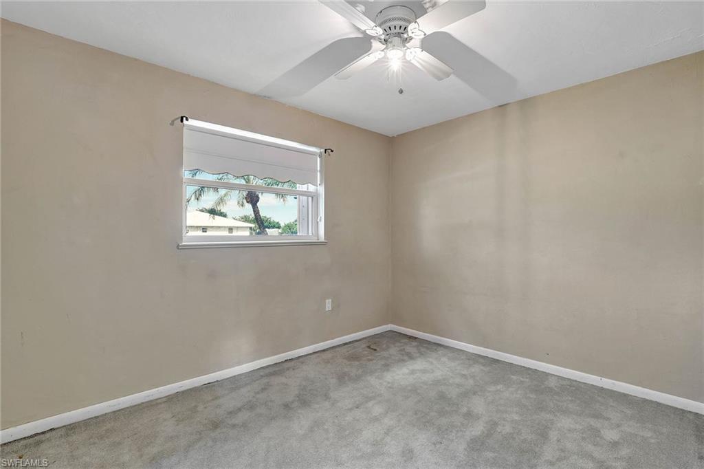 4656 Capri Drive Naples, FL 34103 - Photo 13 of 18 an empty room with a window