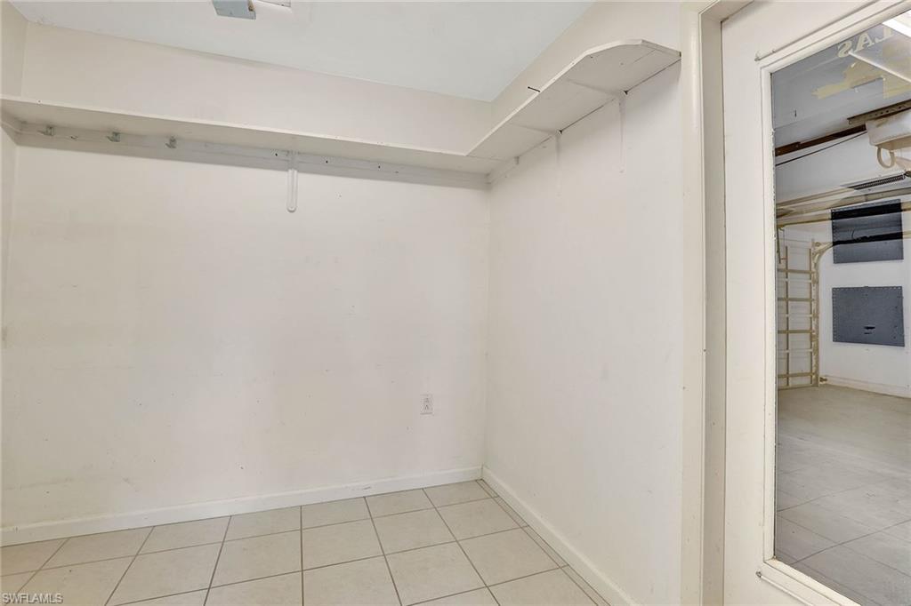 4656 Capri Drive Naples, FL 34103 - Photo 14 of 18 a view of an empty walk in closet