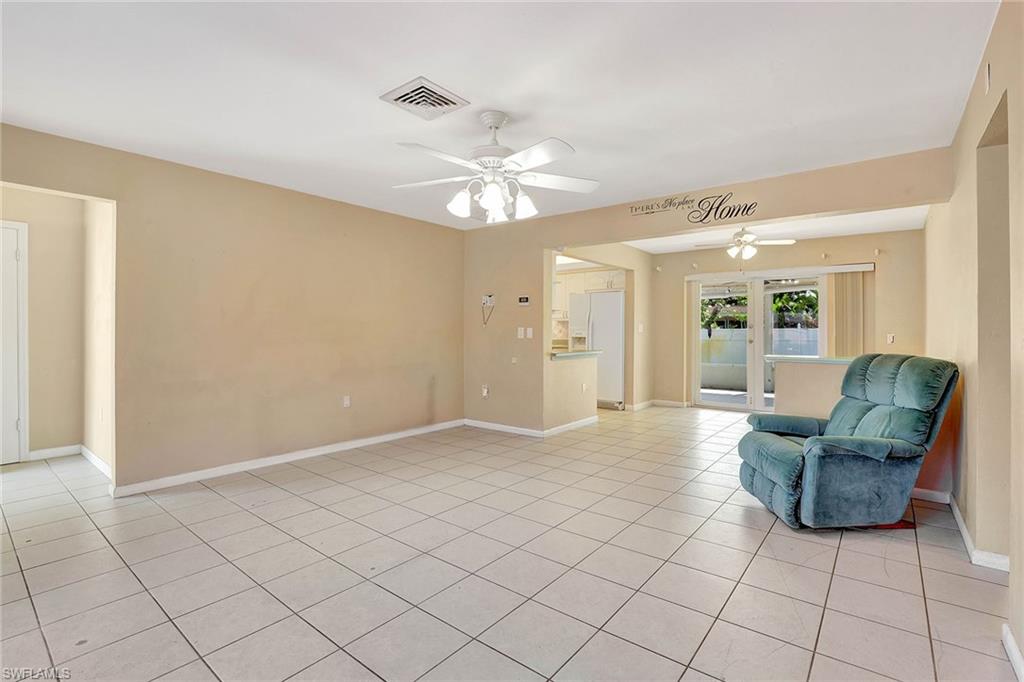 4656 Capri Drive Naples, FL 34103 - Photo 2 of 18 a view of livingroom with furniture and chandelier fan