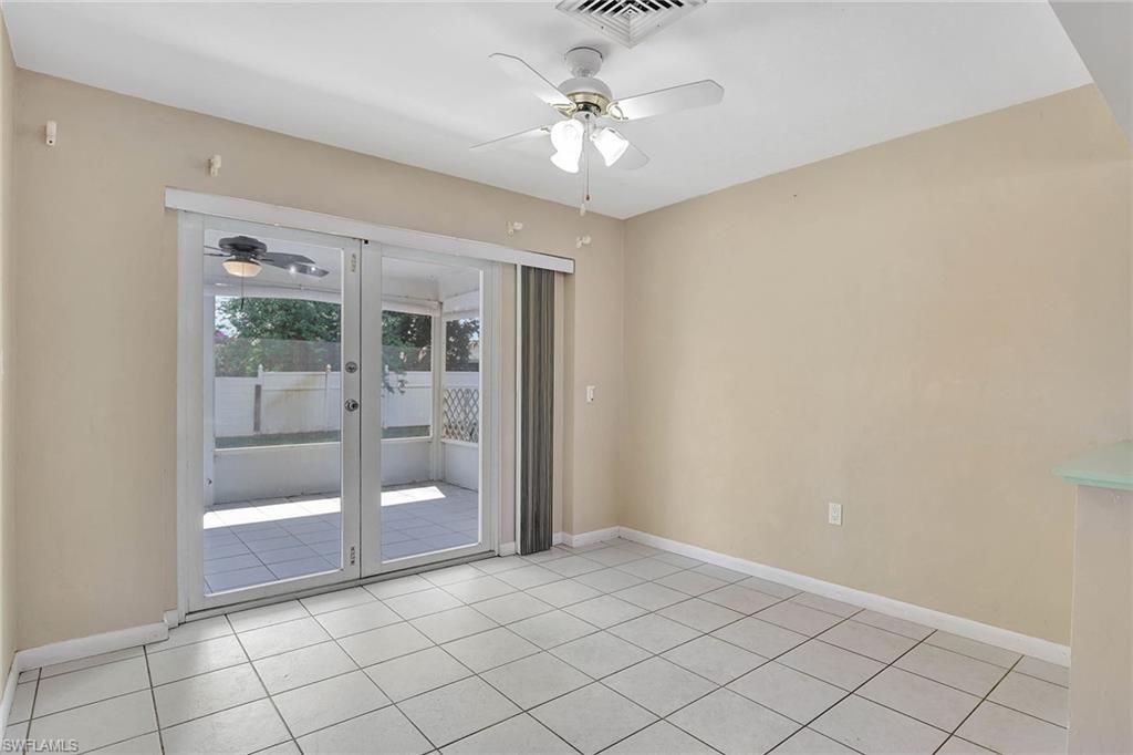 4656 Capri Drive Naples, FL 34103 - Photo 7 of 18 a view of an empty room with a window