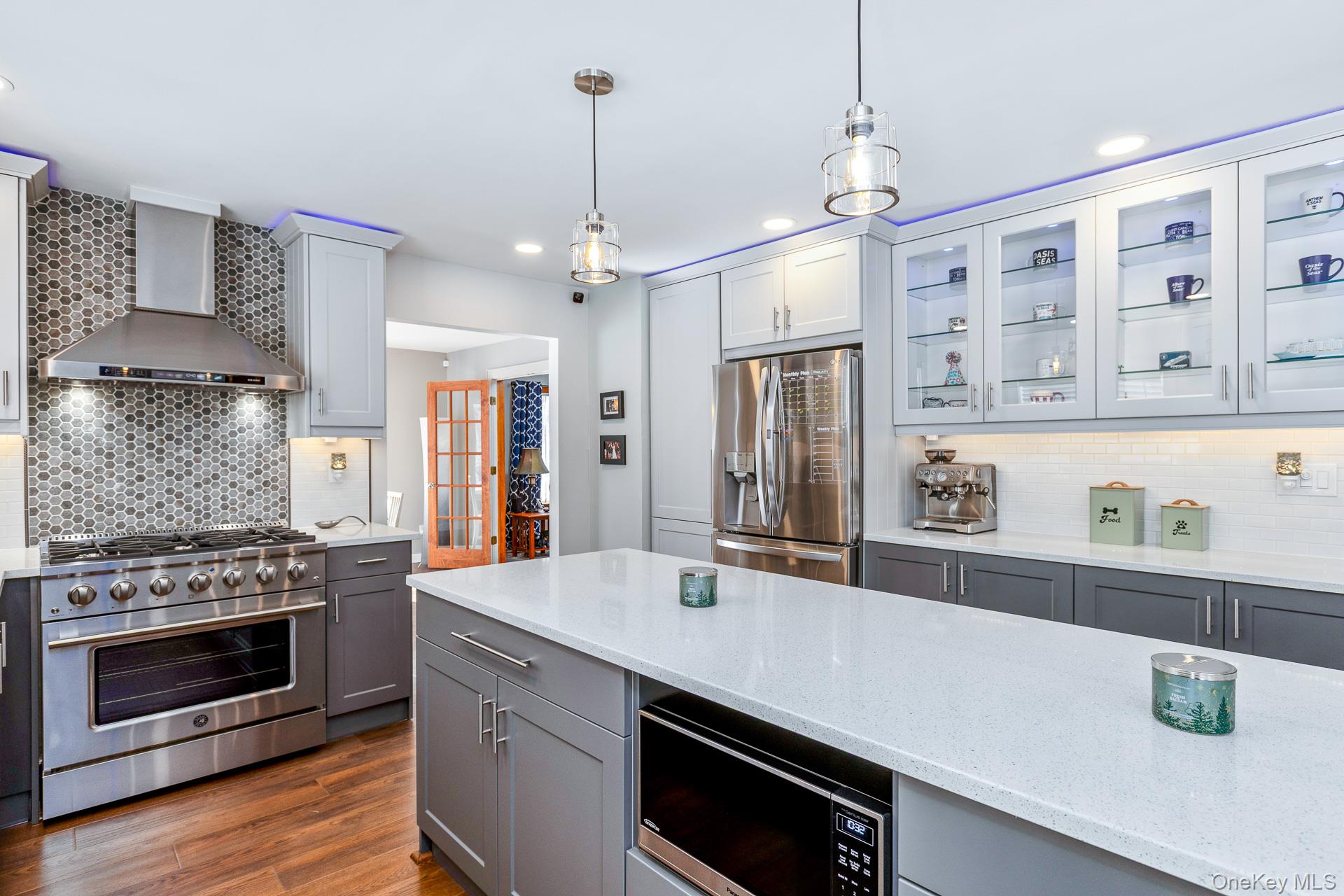 503 Wading River Road Manorville, NY 11949 - Photo 18 of 45 Kitchen featuring backsplash, gray cabinetry, appliances with stainless steel finishes, and recessed lighting