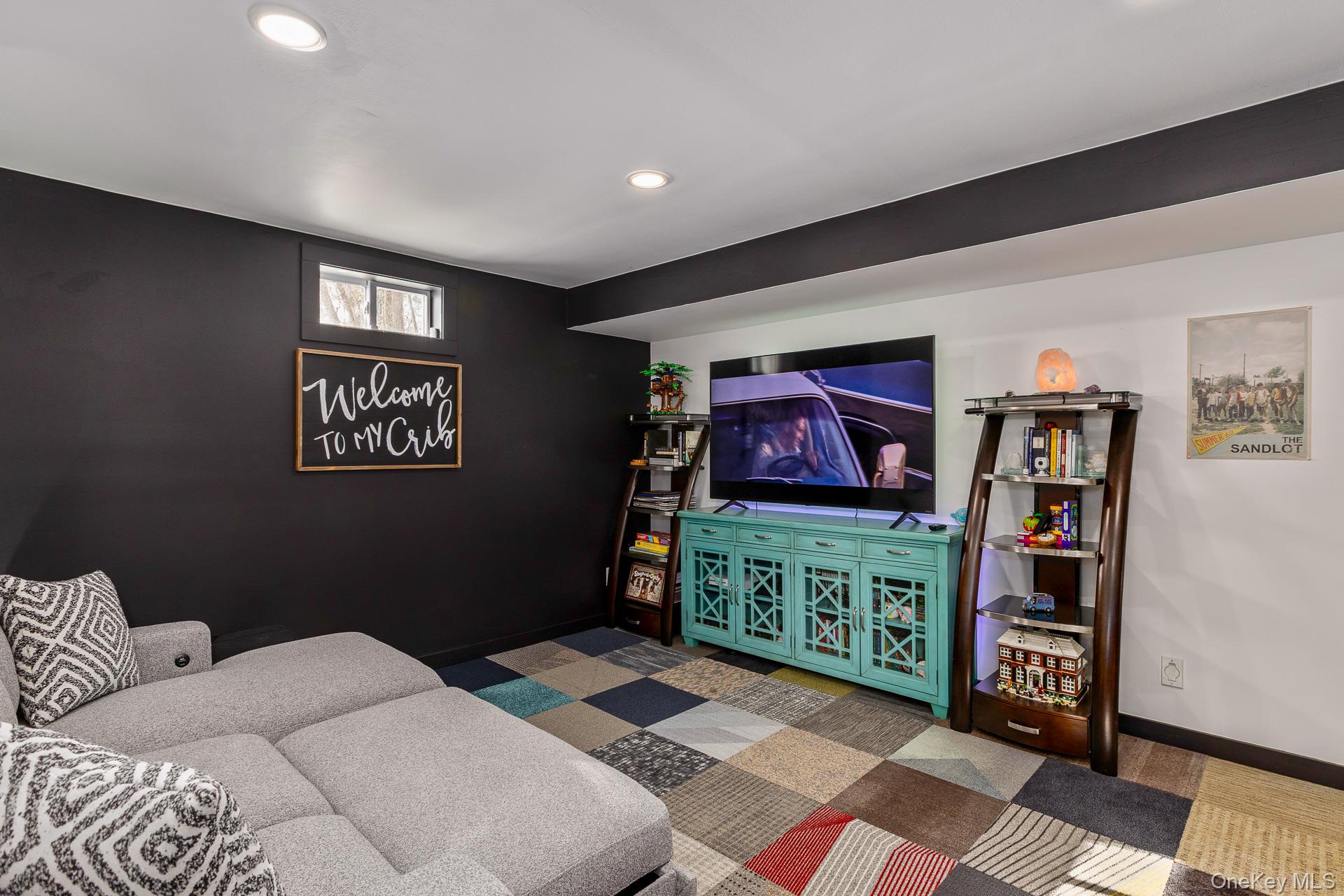 503 Wading River Road Manorville, NY 11949 - Photo 30 of 45 Carpeted living room featuring baseboards and recessed lighting