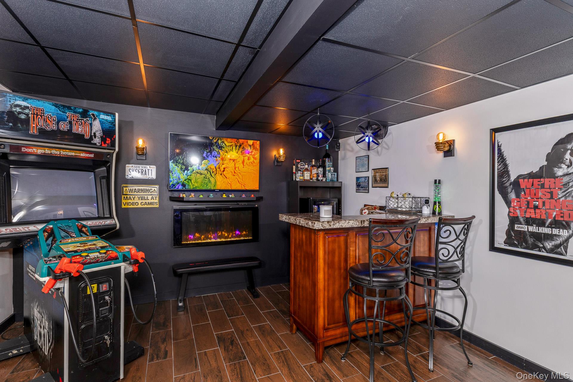 503 Wading River Road Manorville, NY 11949 - Photo 32 of 45 Indoor dry bar with a drop ceiling and a glass covered fireplace