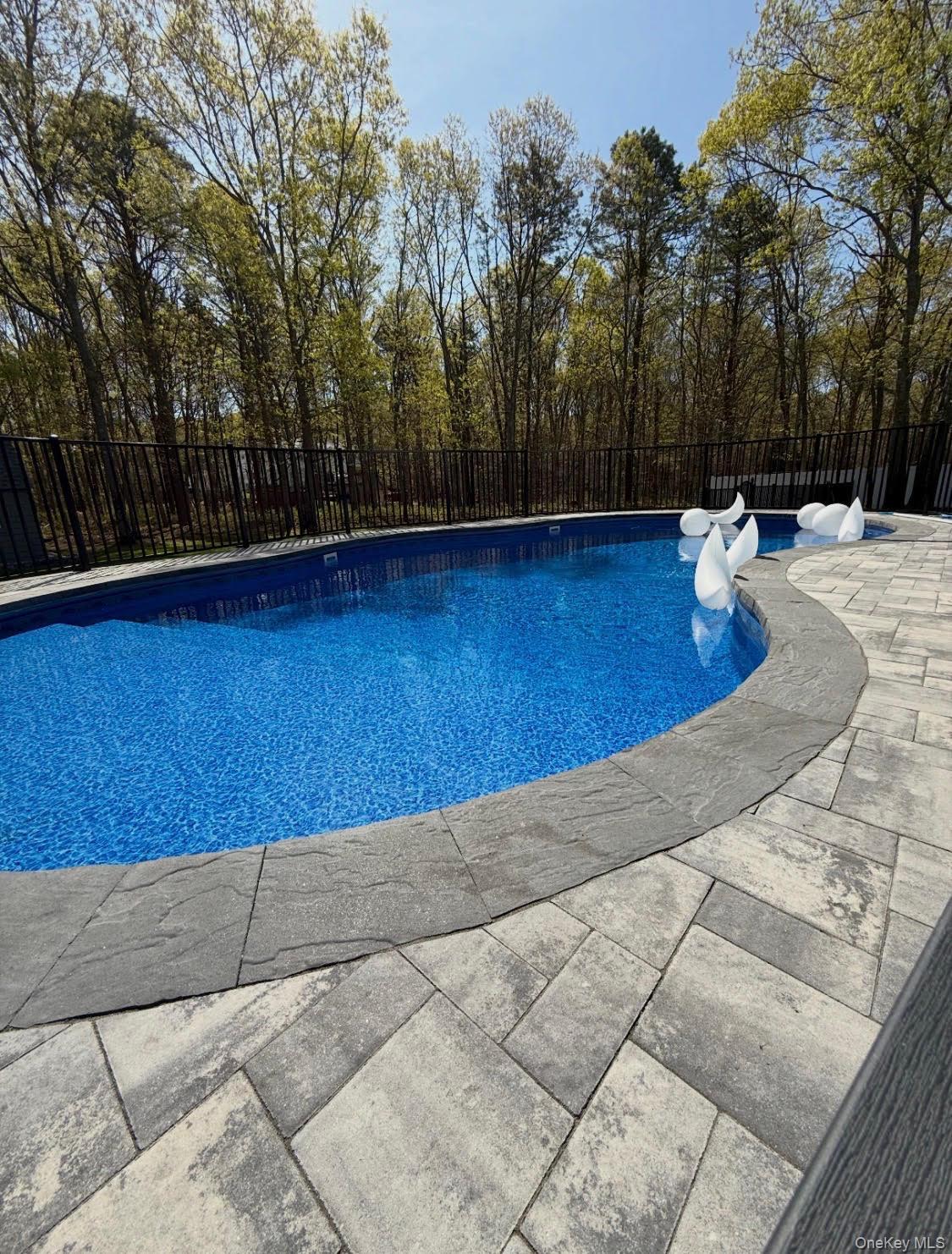 503 Wading River Road Manorville, NY 11949 - Photo 43 of 45 View of swimming pool with a fenced backyard and a patio area