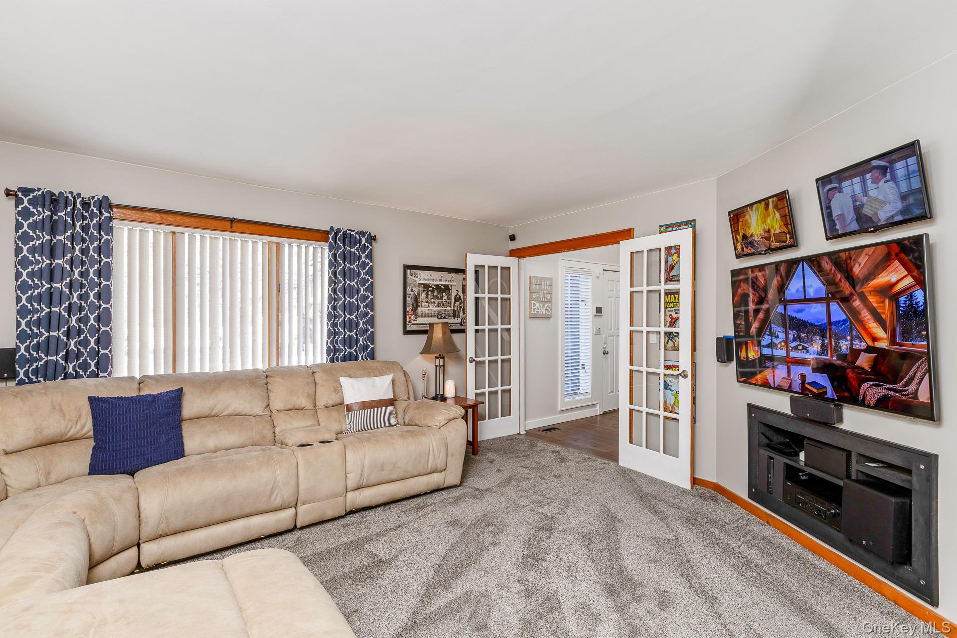 503 Wading River Road Manorville, NY 11949 - Photo 9 of 45 Carpeted living room with french doors