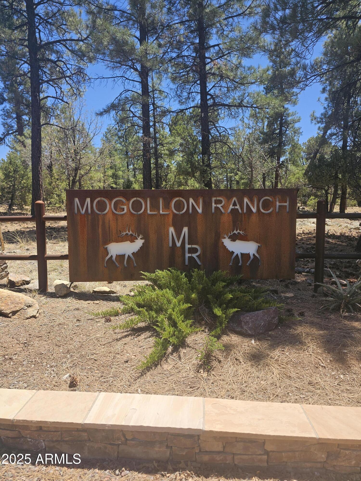 3662 Sunset Ridge Loop, Unit 143 Happy Jack, AZ 86024 - Photo 2 of 8 a sign that is sitting on the side of a road