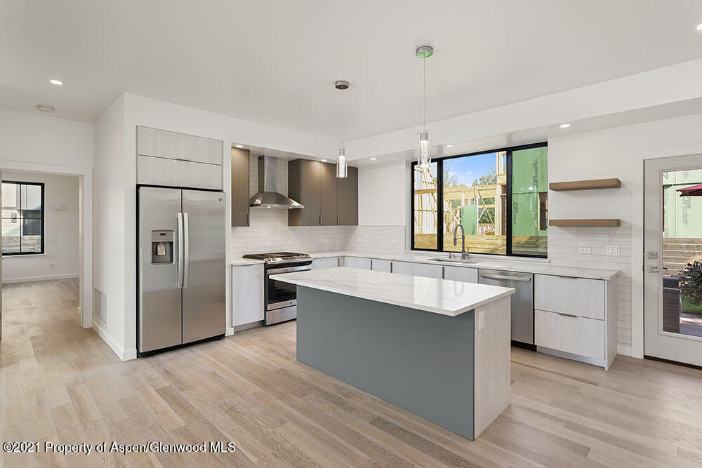 132 Valley Court Basalt, CO 81621 - Photo 12 of 38 a kitchen with stainless steel appliances a sink and a refrigerator
