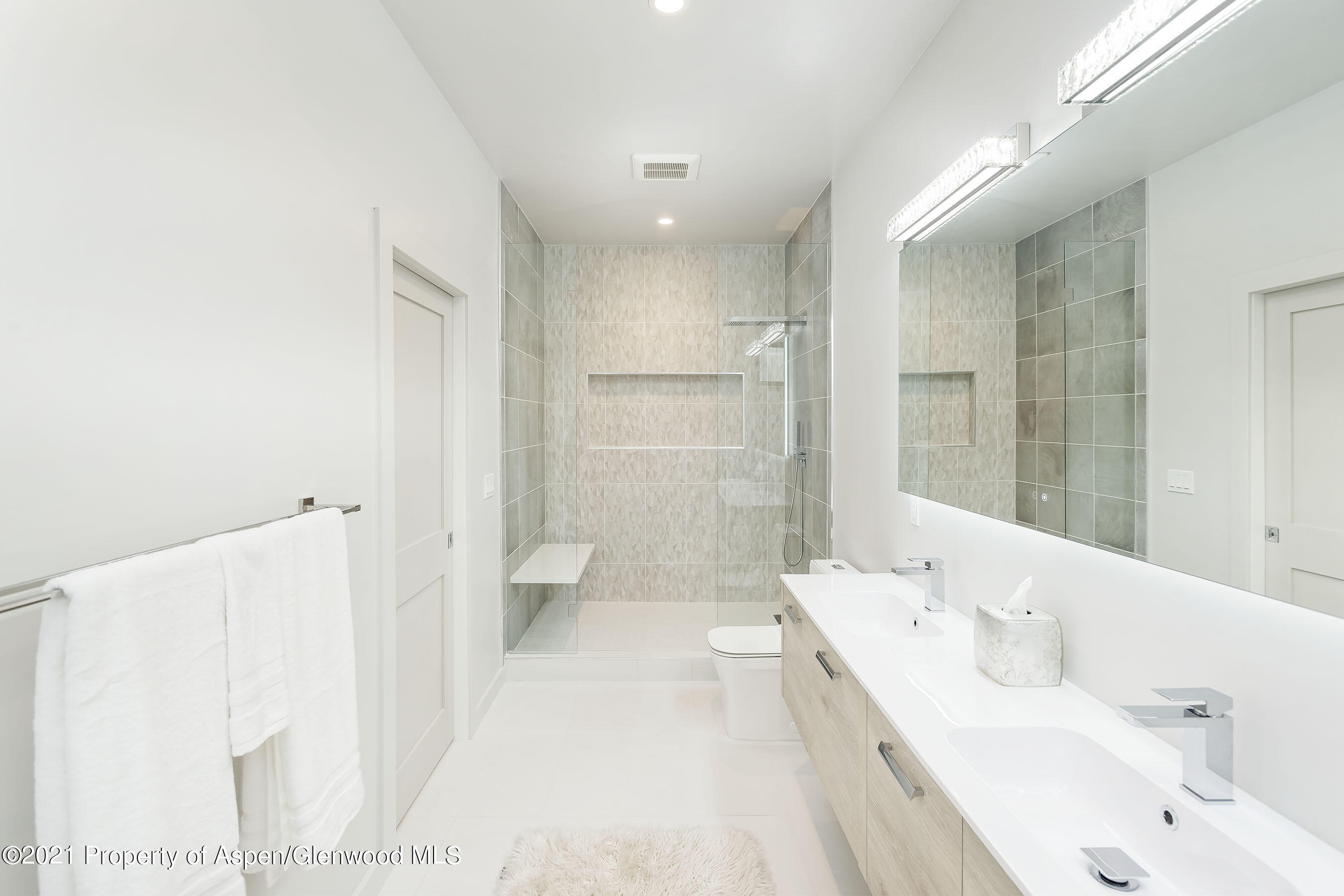 132 Valley Court Basalt, CO 81621 - Photo 18 of 38 a bathroom with a double vanity sink a toilet and shower