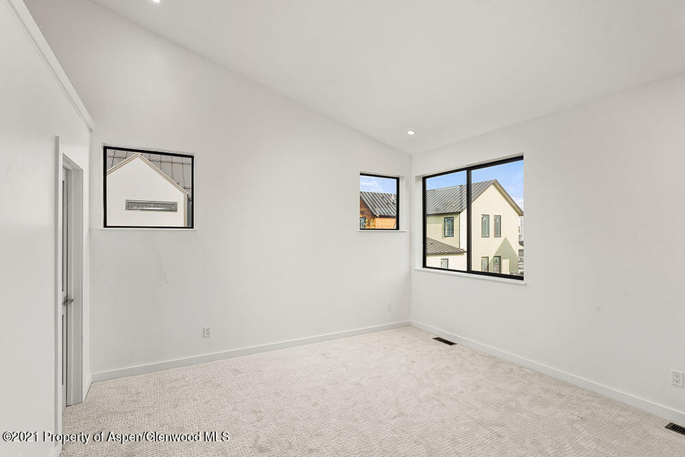 132 Valley Court Basalt, CO 81621 - Photo 19 of 38 an empty room with windows and closet