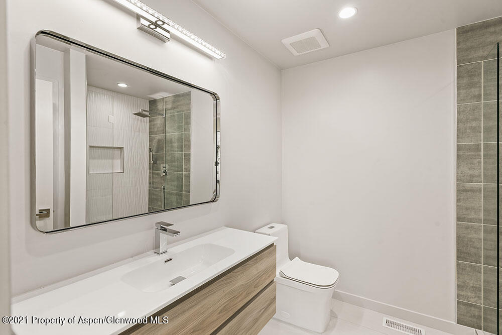 132 Valley Court Basalt, CO 81621 - Photo 21 of 38 a bathroom with a sink a toilet and shower