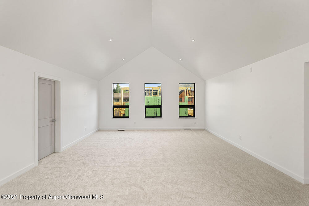132 Valley Court Basalt, CO 81621 - Photo 25 of 38 wooden floor in an empty room with window