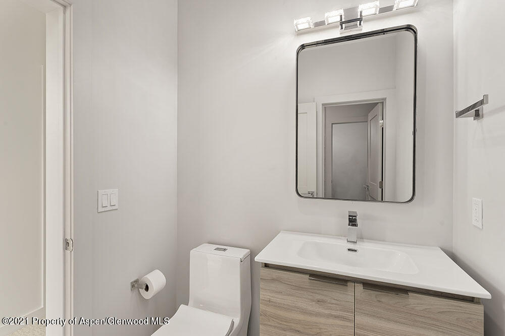 132 Valley Court Basalt, CO 81621 - Photo 27 of 38 a bathroom with a toilet sink and mirror