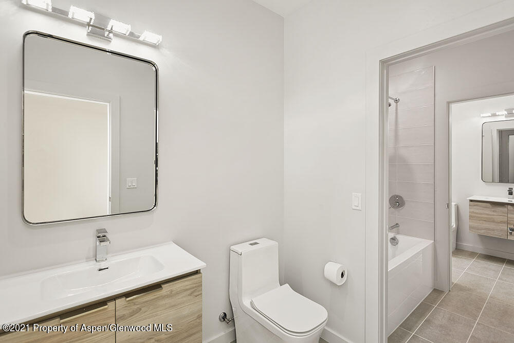 132 Valley Court Basalt, CO 81621 - Photo 29 of 38 a white toilet sitting next to a bathroom sink