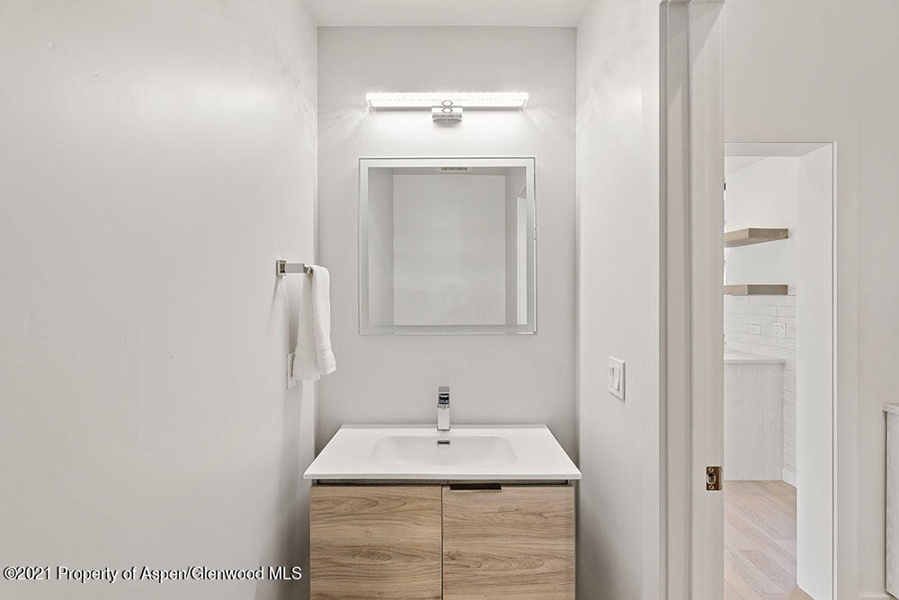 132 Valley Court Basalt, CO 81621 - Photo 31 of 38 a bathroom with a sink and a mirror
