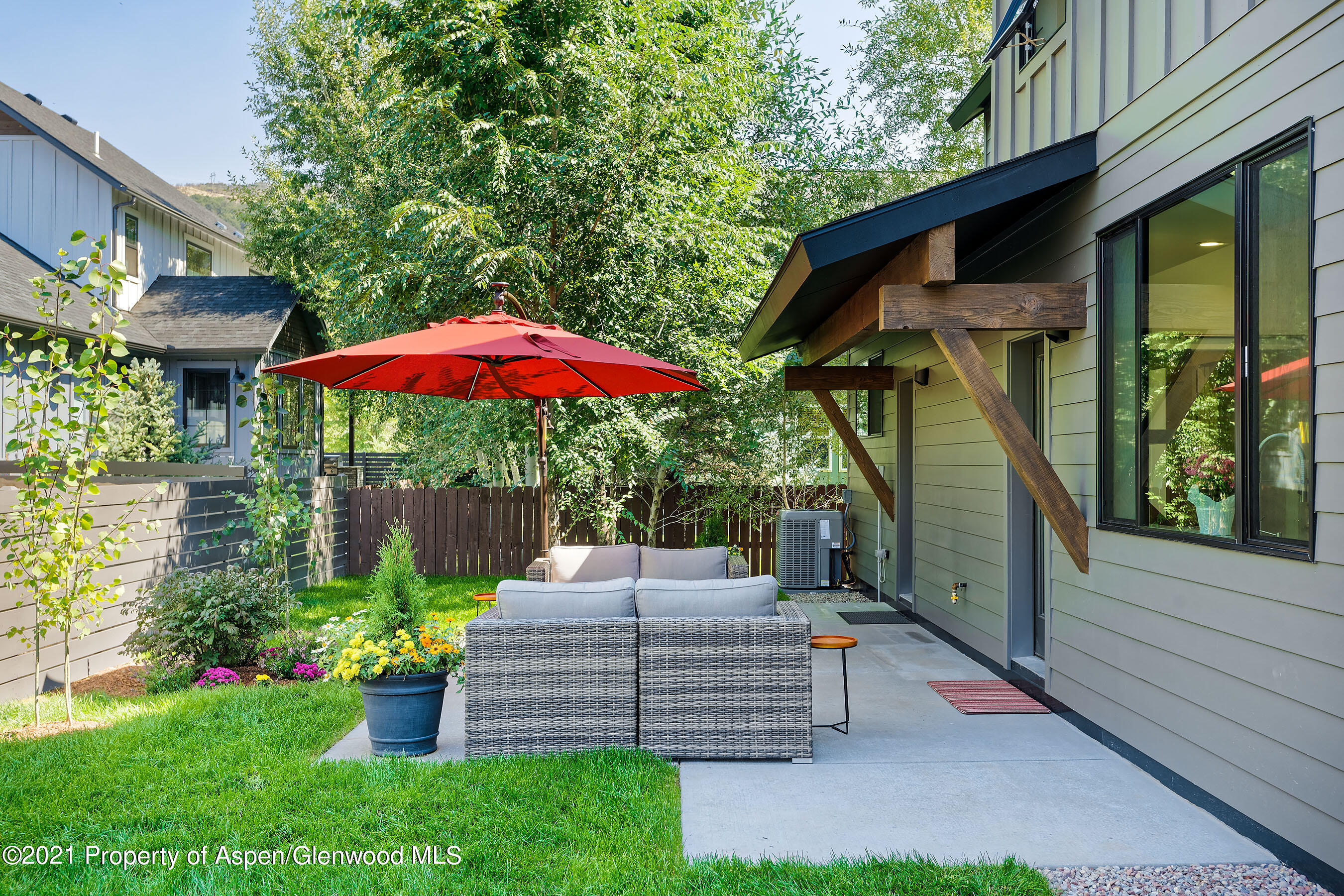 132 Valley Court Basalt, CO 81621 - Photo 6 of 38 a view of a chair and table with umbrella in front of house