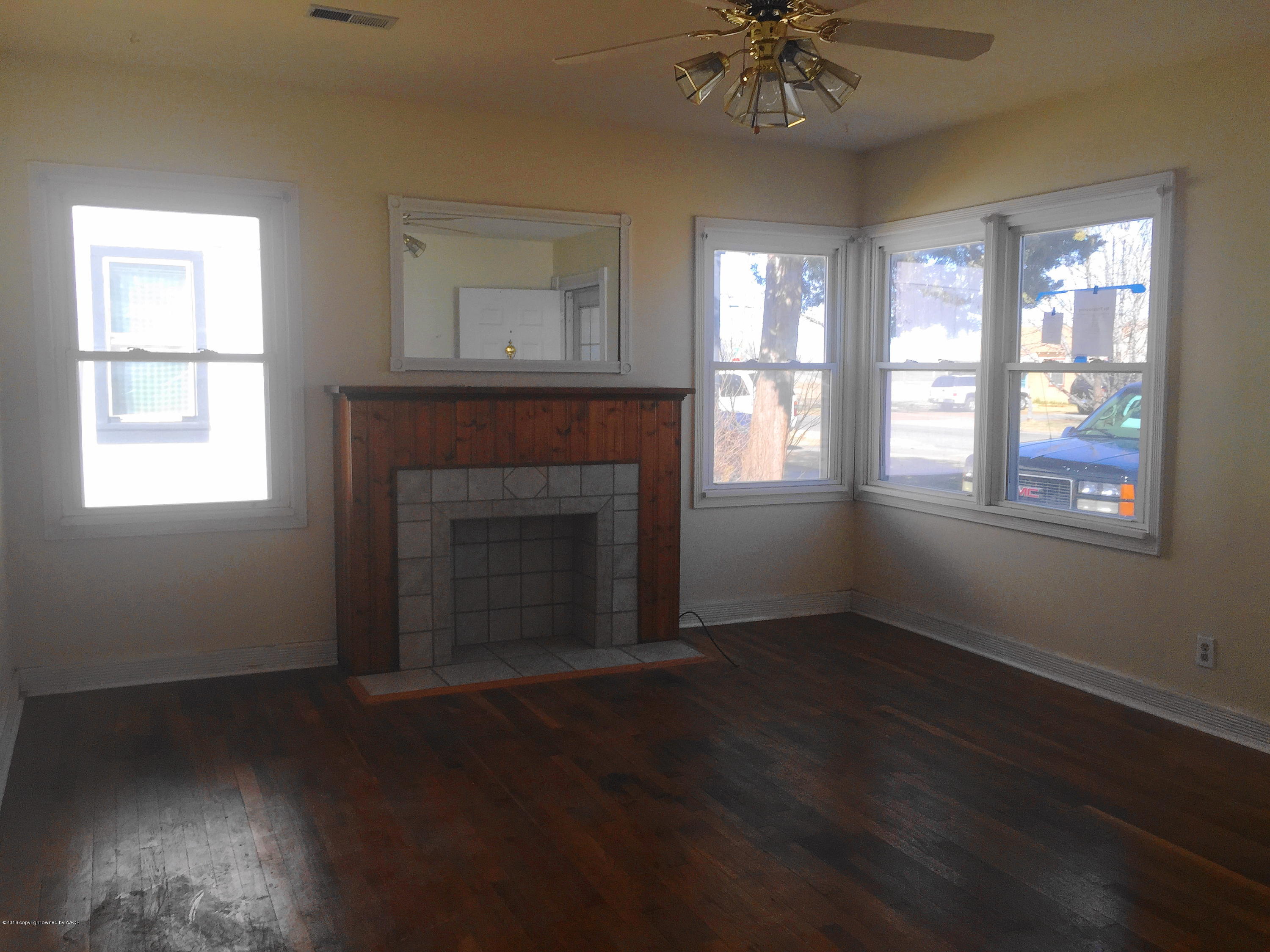906 South Austin Street Amarillo, TX 79102 - Photo 2 of 10 a view of an empty room with a window