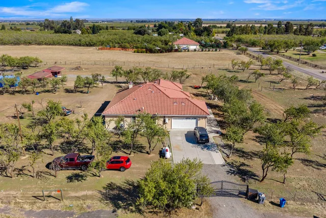 an aerial view of house with yard