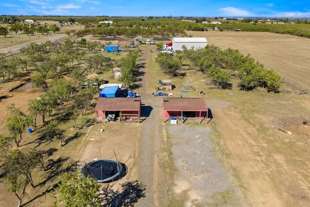 an aerial view of a chairs and table on the terrace
