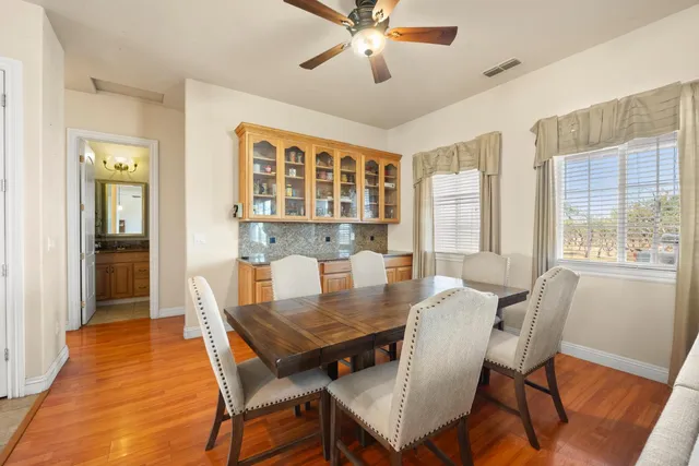 a view of a dining room with furniture window and wooden floor