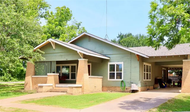 a front view of a house with yard and seating area