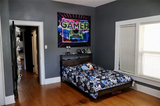 a bed room with a bed and a window