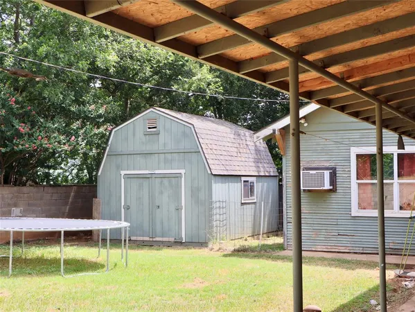 a front view of a house with a yard table and chairs