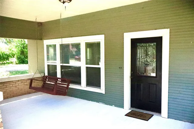 a outdoor space with sliding door and wooden floor