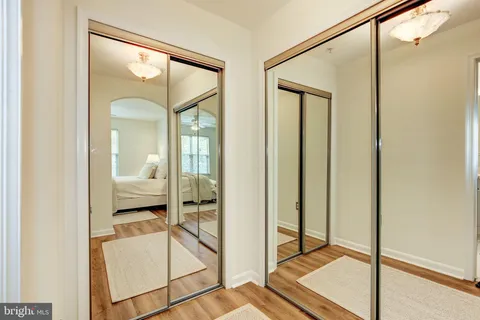 a bathroom with a glass shower door and a mirror