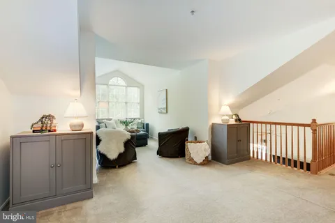 a view of a livingroom with furniture and windows