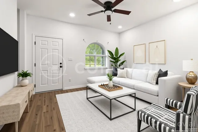 a living room with furniture and a large window