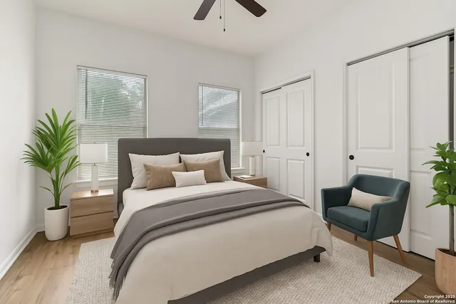 a bedroom with a bed and a potted plant