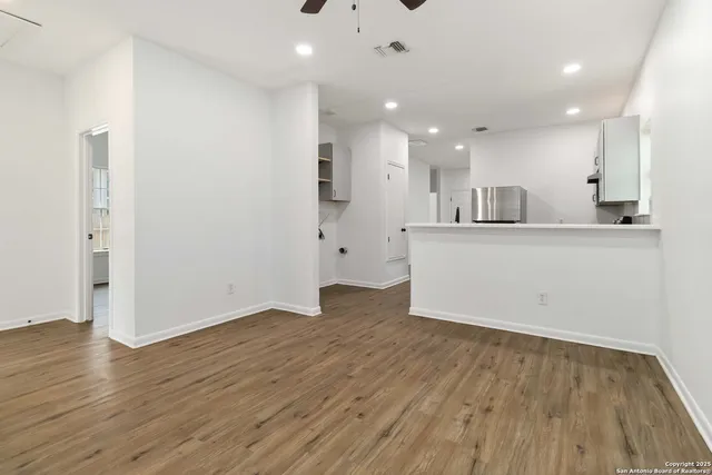 a view of kitchen with wooden floor