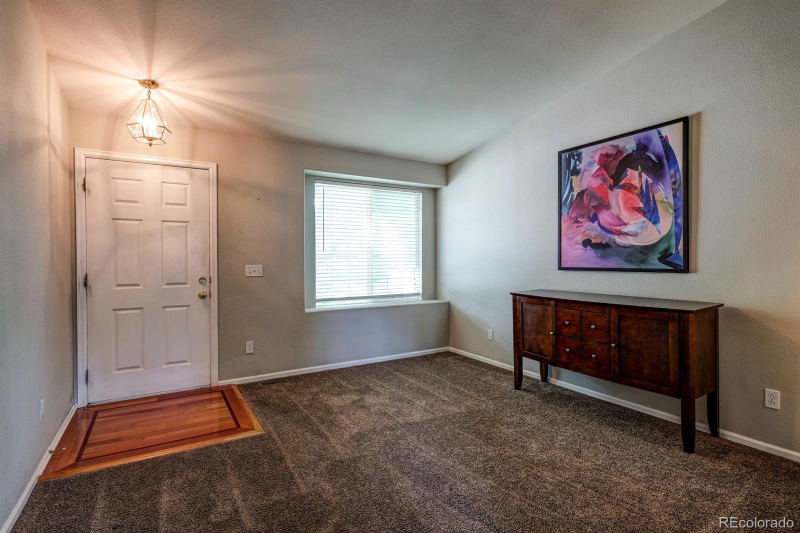 1045 Riddlewood Lane Highlands Ranch, CO 80129 - Photo 15 of 26 a view of room with window and a ceiling fan