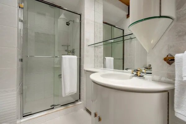 a bathroom with a sink and mirror