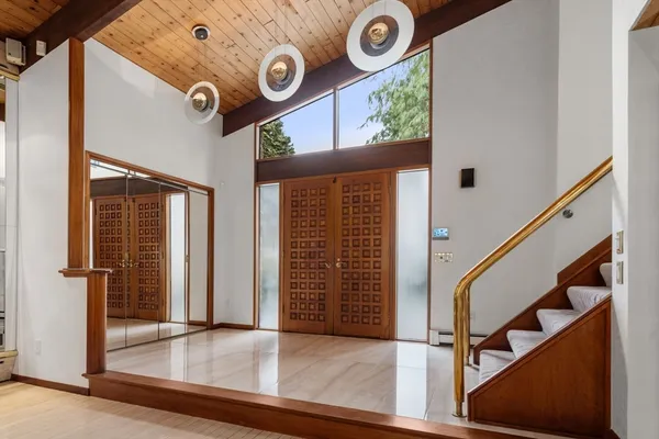 an entryway with wooden floor