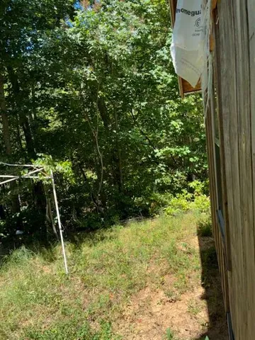 a backyard of a house with outdoor seating