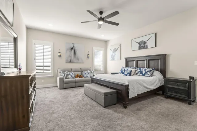 a bedroom with a bed and a television