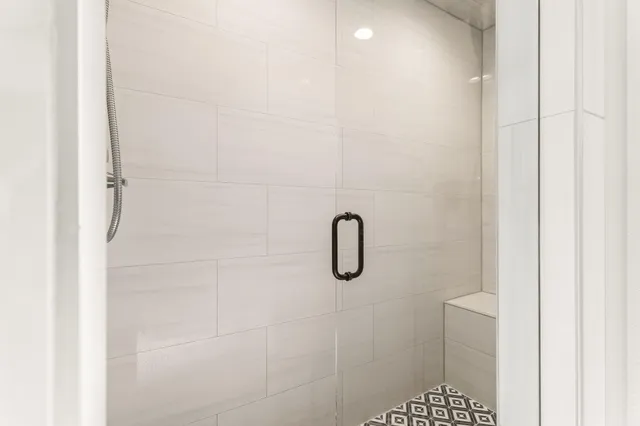 a spacious bathroom with a granite countertop sink mirror and a