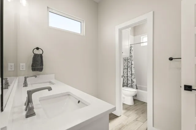 a bathroom with a toilet and a bathtub