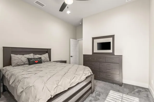 a utility room with cabinets washer and dryer