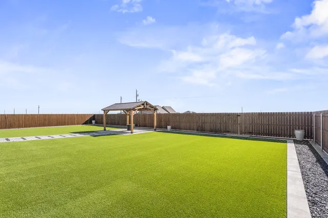 a view of swimming pool with seating area