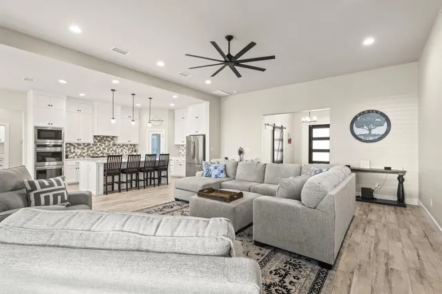 a living room with furniture white walls and white walls