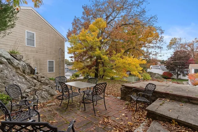 a view of a backyard with sitting area